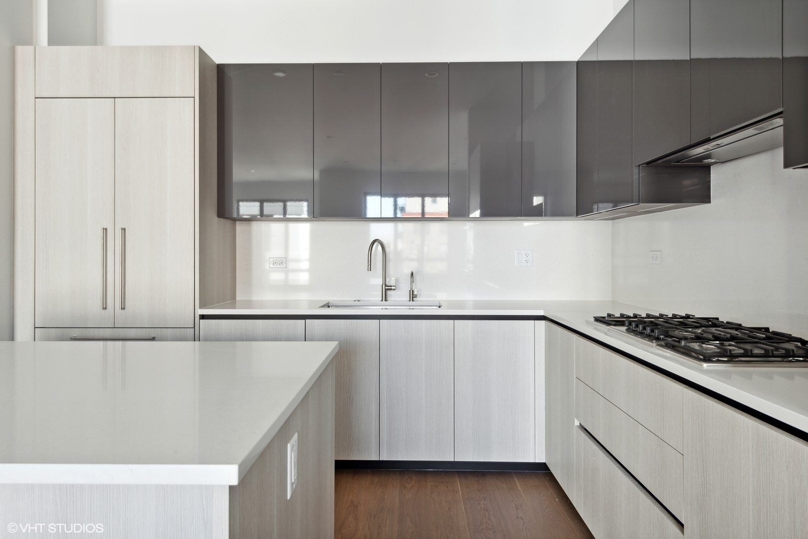 323 South Racine Avenue, Unit 6B Chicago, IL 60607 - Photo 8 of 25 a kitchen with stainless steel appliances cabinets and wooden floor