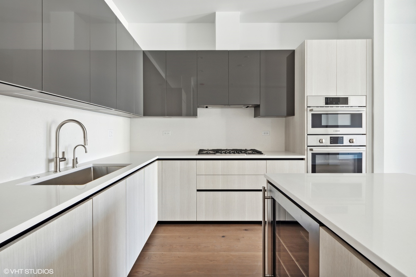 323 South Racine Avenue, Unit 6B Chicago, IL 60607 - Photo 9 of 25 a kitchen with a sink cabinets and stainless steel appliances