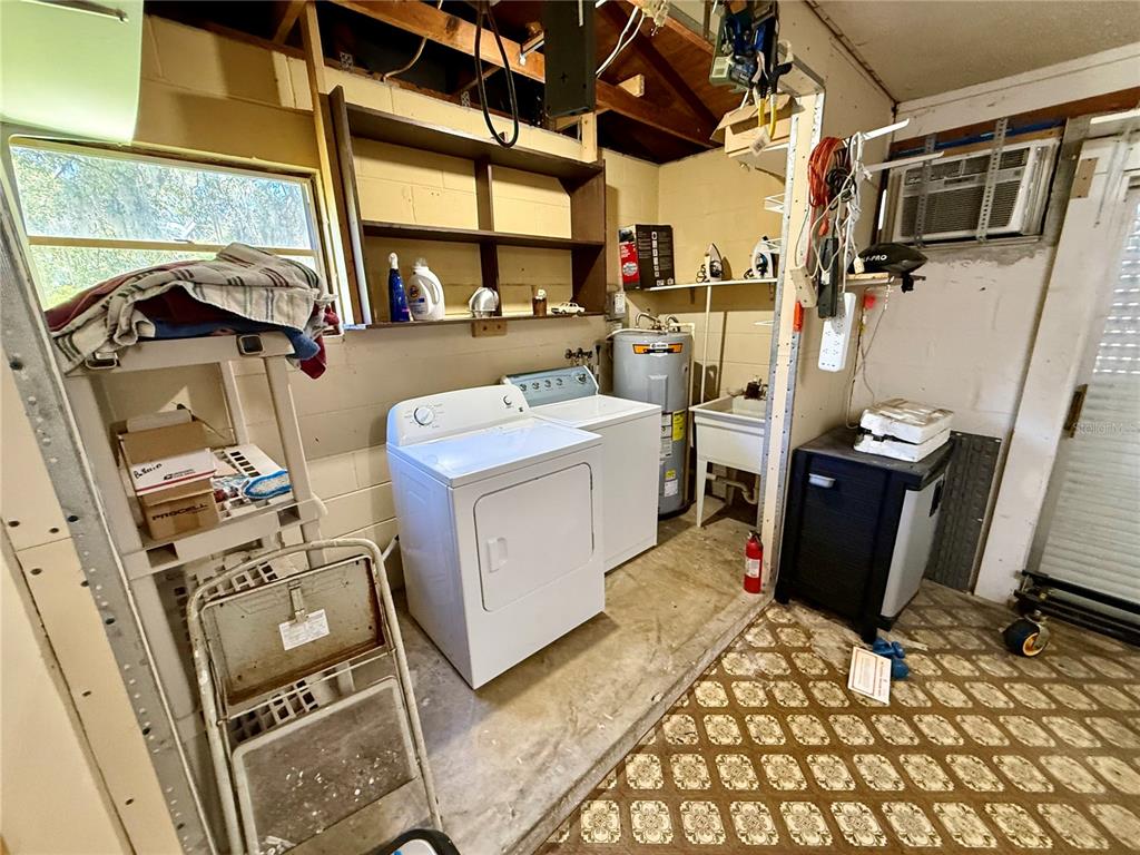1004 Connecticut Road Tarpon Springs, FL 34689 - Photo 38 of 57 a view of a storage & utility room with a sink