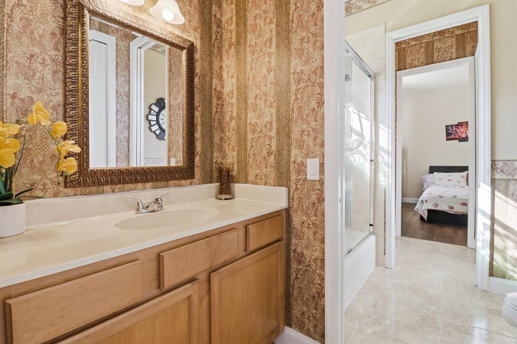 2125 Southeast 25th Loop Ocala, FL 34471 - Photo 34 of 60 a en suite bathroom with a sink and a mirror