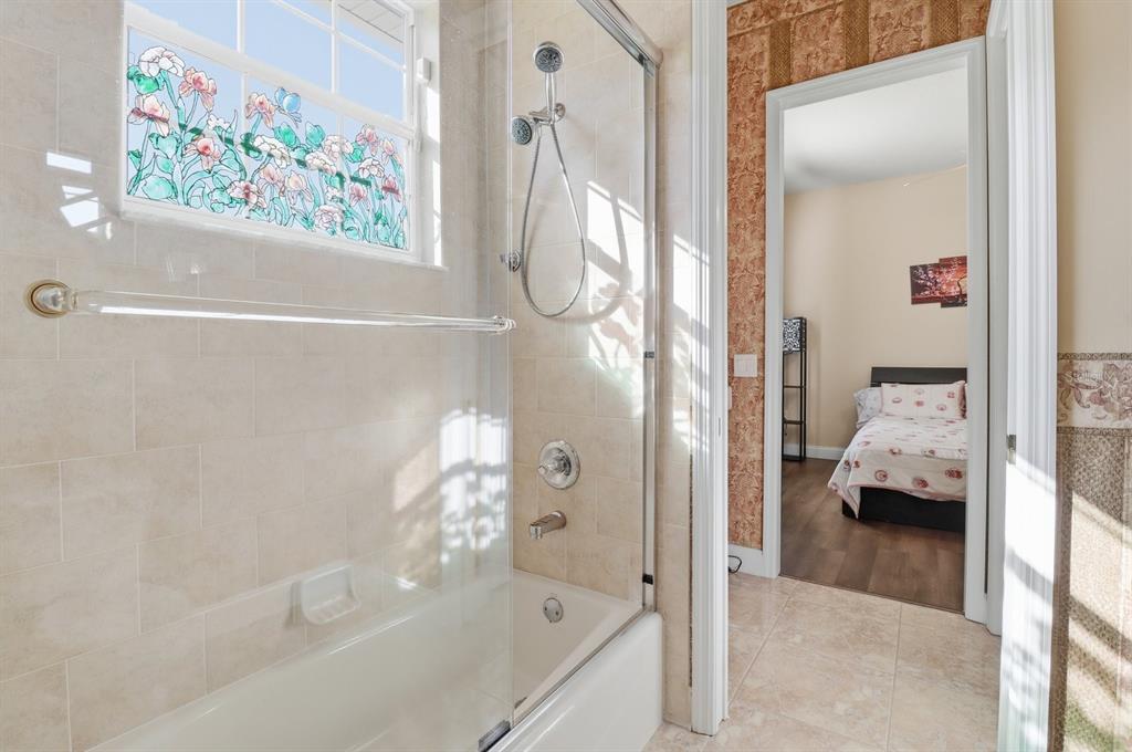 2125 Southeast 25th Loop Ocala, FL 34471 - Photo 35 of 60 a en suite bathroom with a tub and shower
