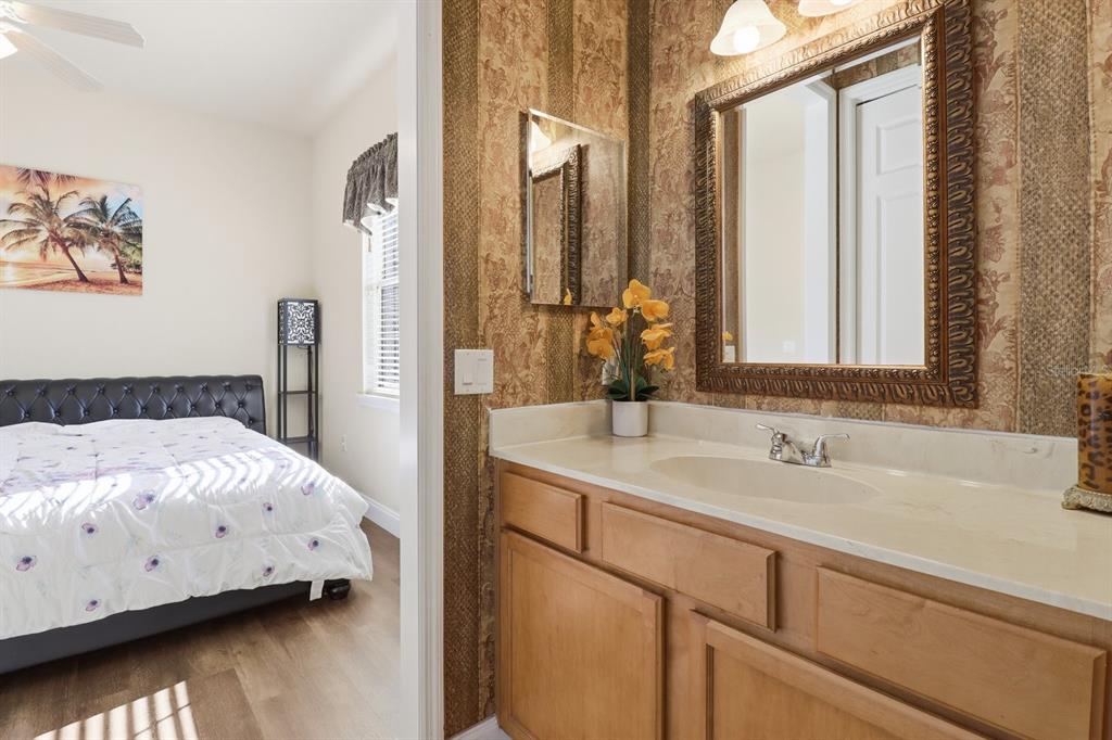 2125 Southeast 25th Loop Ocala, FL 34471 - Photo 36 of 60 a en suite bathroom with a sink and a mirror