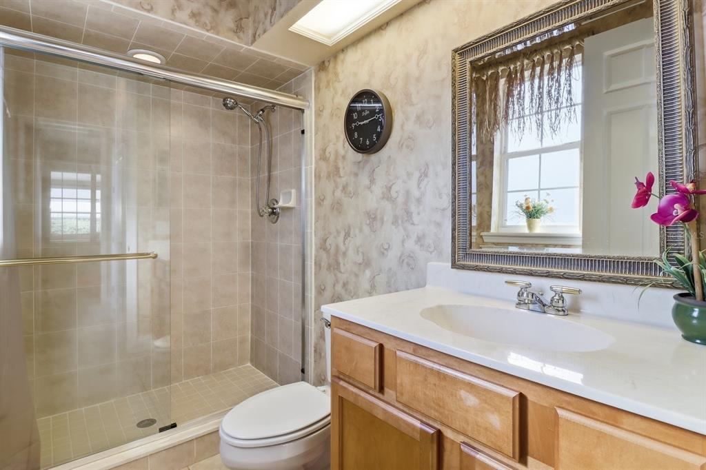2125 Southeast 25th Loop Ocala, FL 34471 - Photo 38 of 60 a bathroom with a sink a toilet and shower