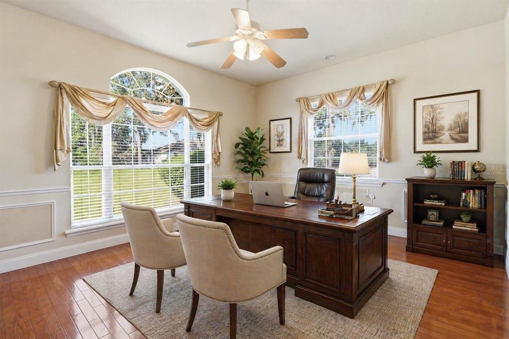2125 Southeast 25th Loop Ocala, FL 34471 - Photo 10 of 60 a view of a dining room with furniture window and wooden floor