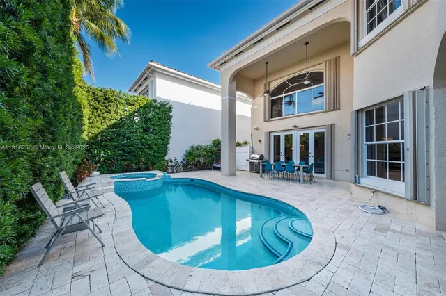 a living room with furniture a rug and a large window