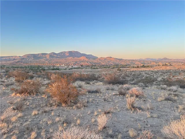 a view of a lake with mountains in the background