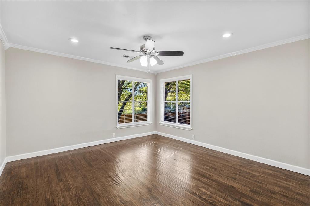 653 Kessler Boulevard Sherman, TX 75092 - Photo 14 of 30 a view of an empty room with wooden floor and a window