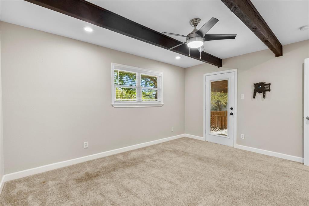 653 Kessler Boulevard Sherman, TX 75092 - Photo 25 of 30 an empty room with windows and fan