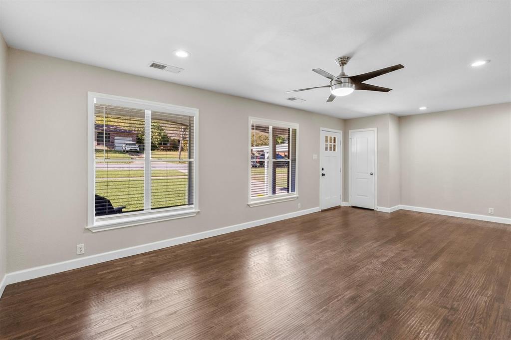 653 Kessler Boulevard Sherman, TX 75092 - Photo 29 of 30 a view of an empty room with a window and wooden floor