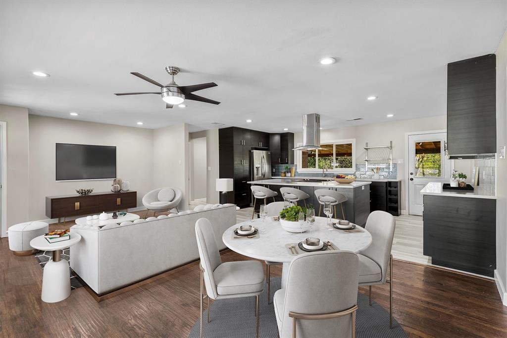 653 Kessler Boulevard Sherman, TX 75092 - Photo 5 of 30 a view of a dining room with furniture a rug and wooden floor