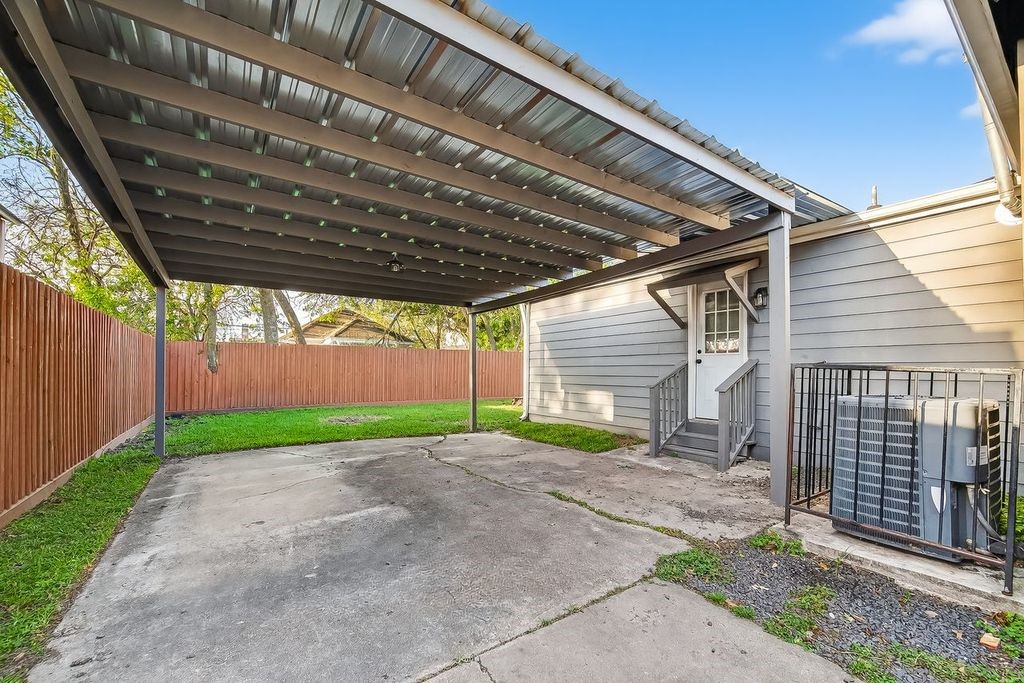 4520 Sharon Street Houston, TX 77020 - Photo 15 of 15 Long driveway leading to a covered carport conveniently connected to the back entrance of the home.