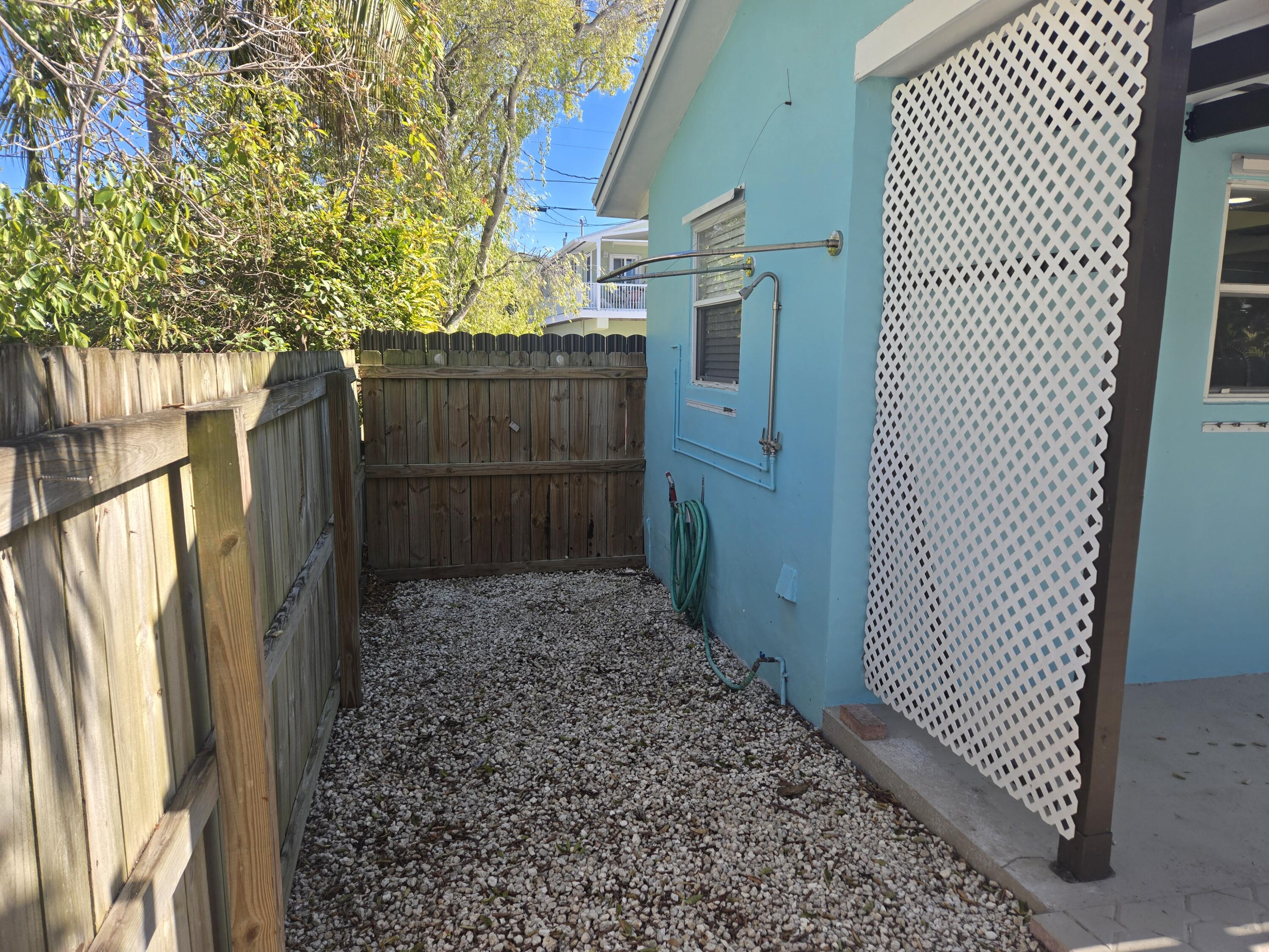 37 Orange Drive Key Largo, FL 33037 - Photo 11 of 12 a view of a pathway of a wooden fence