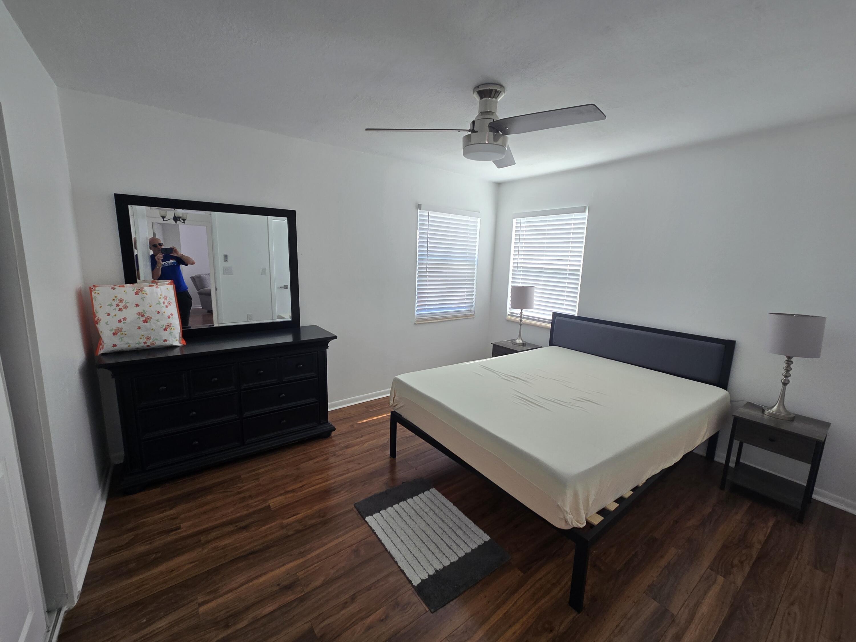 37 Orange Drive Key Largo, FL 33037 - Photo 6 of 12 a room with a bed and a dresser