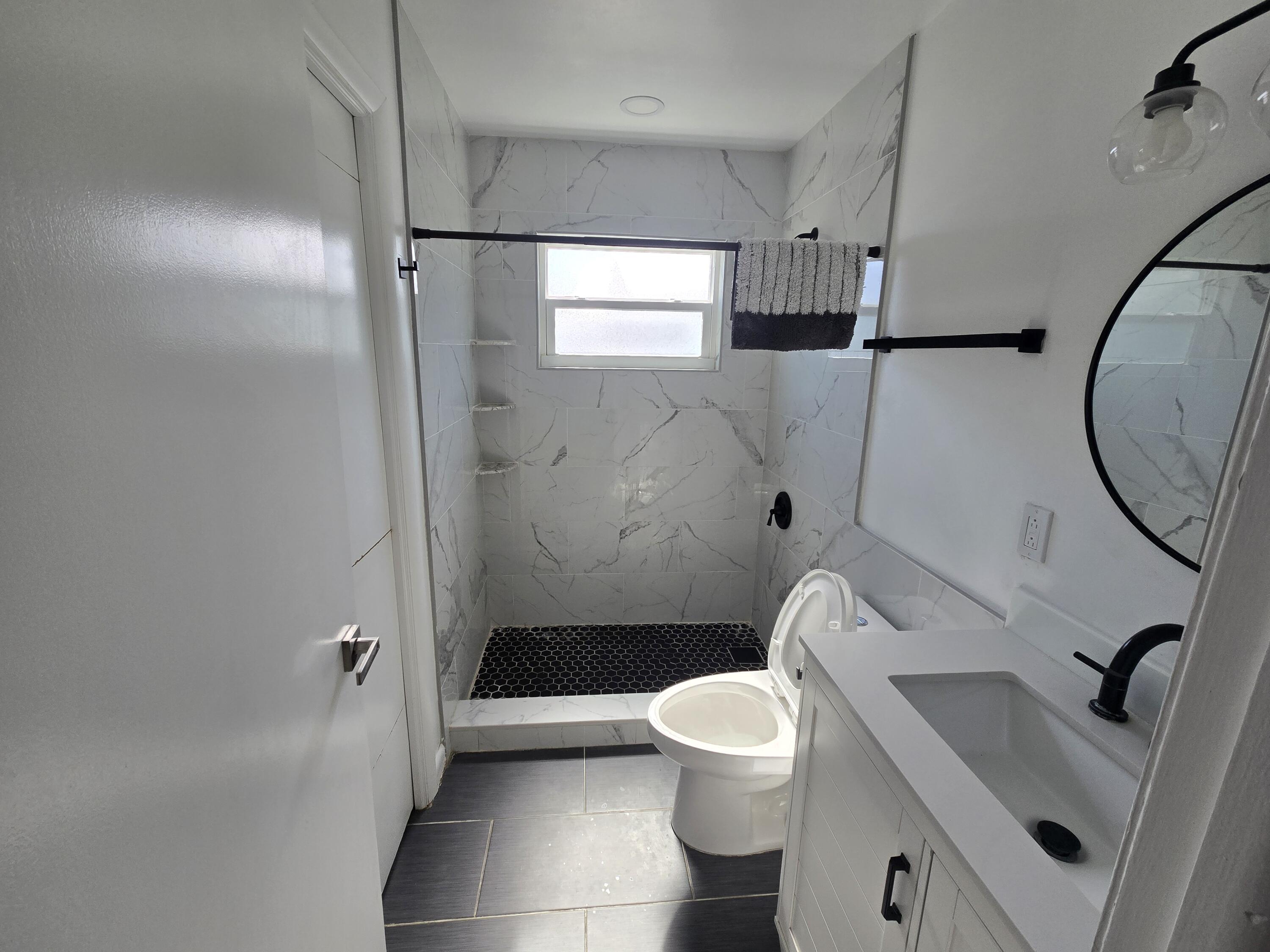 37 Orange Drive Key Largo, FL 33037 - Photo 7 of 12 a bathroom with a sink a toilet and shower