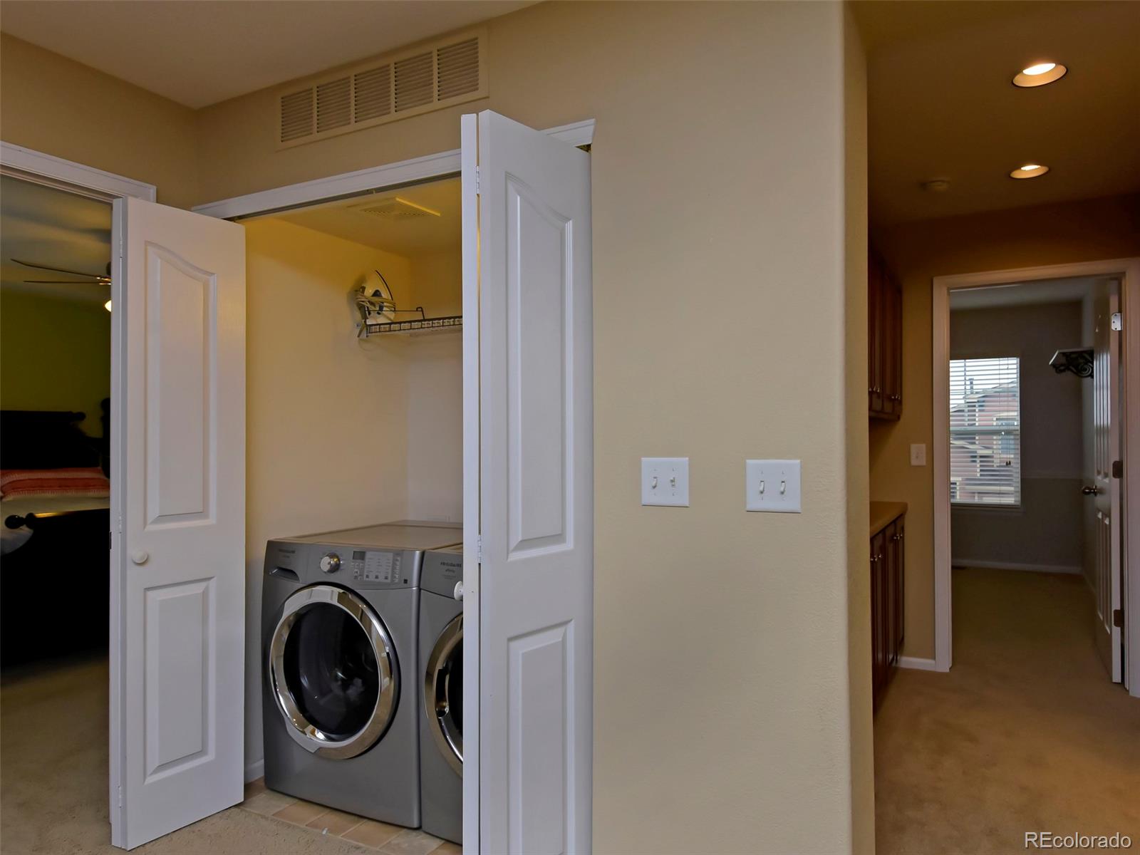 10926 Brooklawn Road Highlands Ranch, CO 80130 - Photo 15 of 25 a view of a hallway with washer and dryer