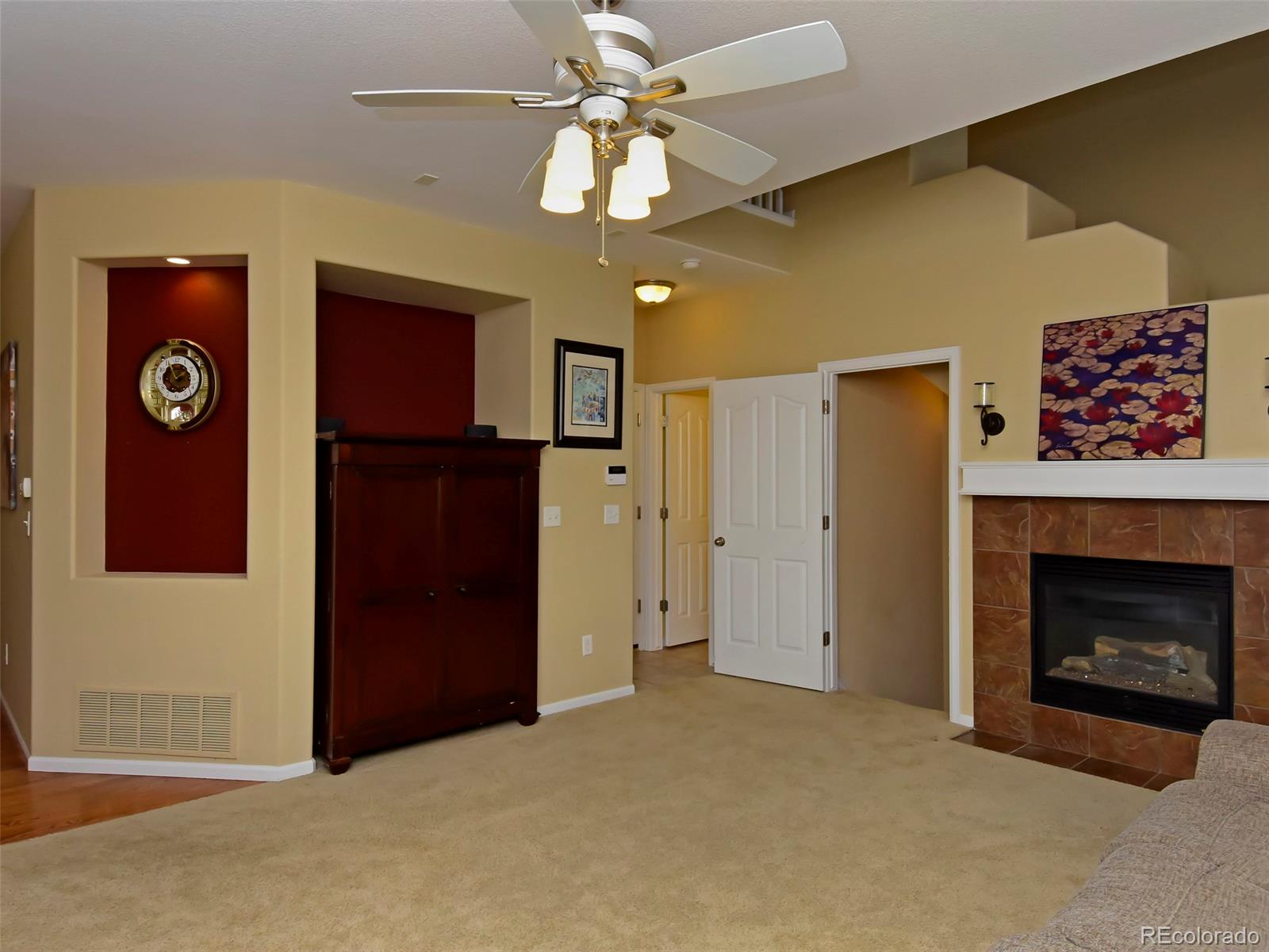 10926 Brooklawn Road Highlands Ranch, CO 80130 - Photo 8 of 25 a view of an empty room with a fireplace