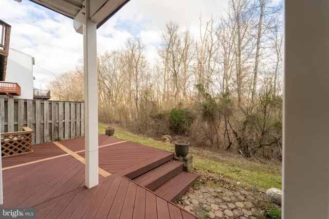 a view of a balcony with wooden floor