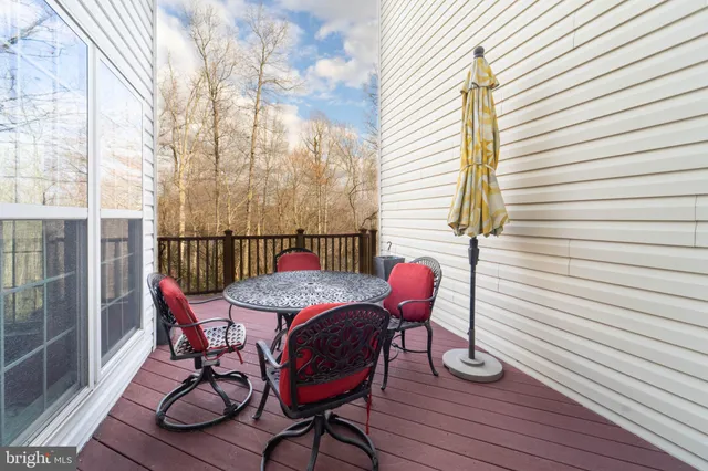 a view of a deck with furniture