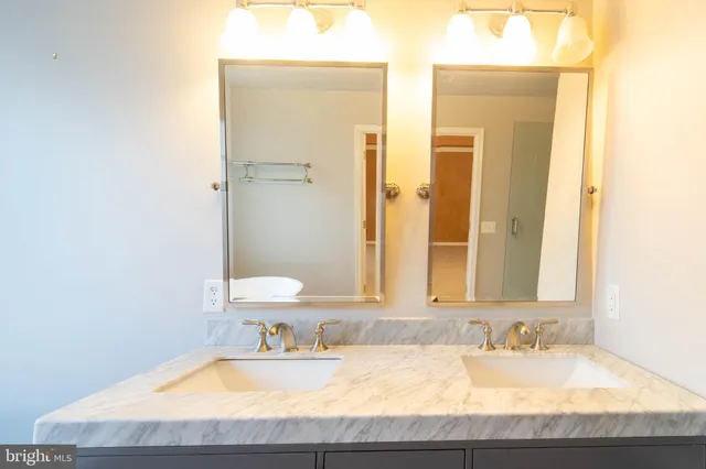 a bathroom with a glass shower door