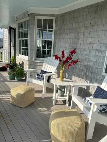 a view of a house with swimming pool and dining room