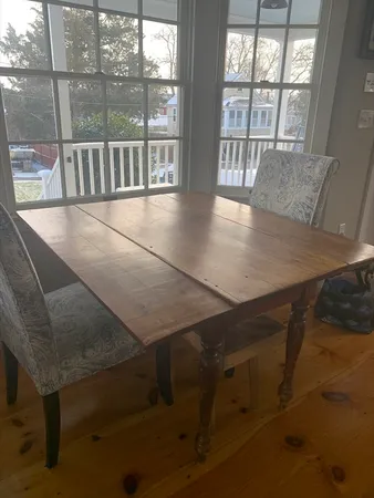 a view of an outdoor dining room with furniture