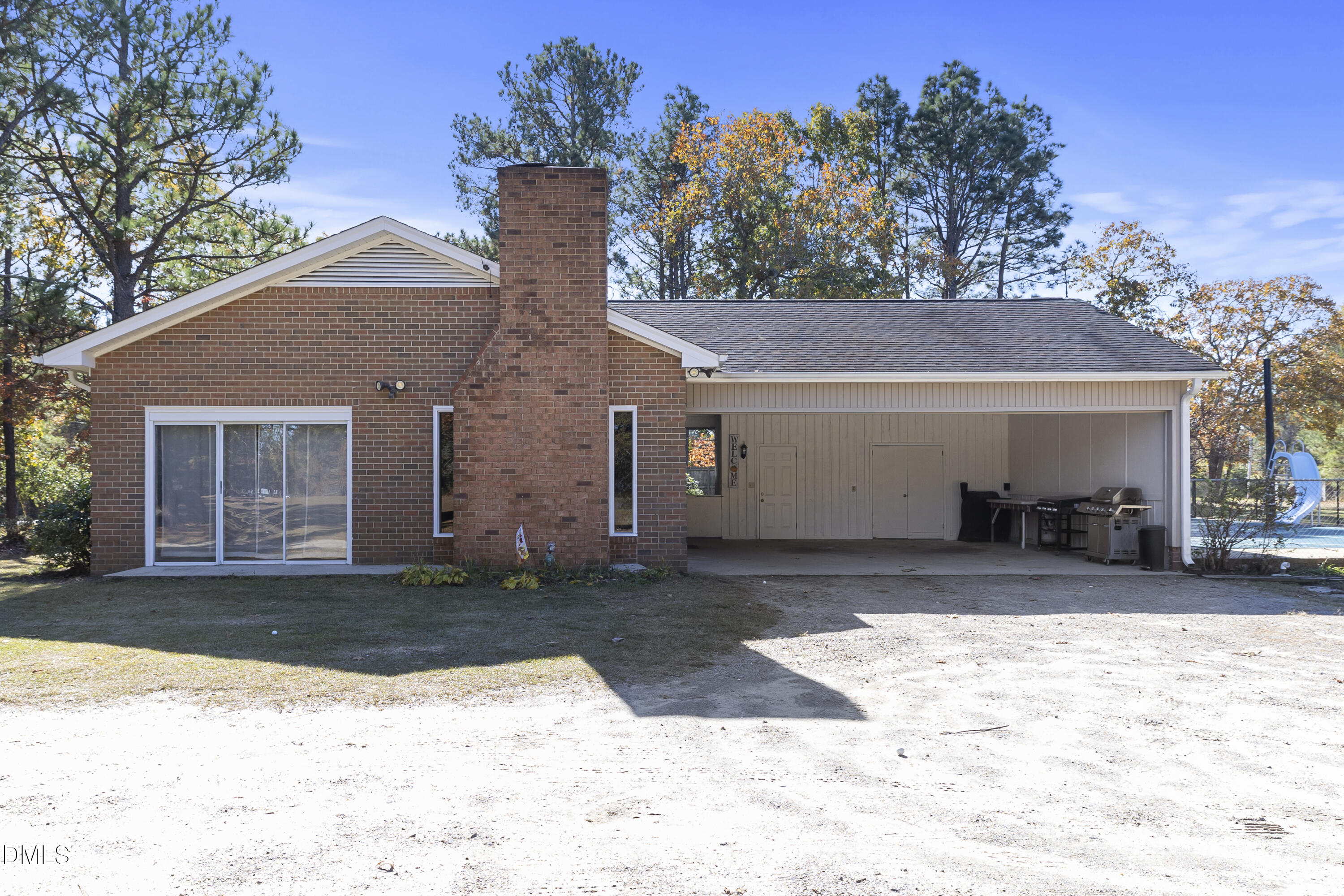 2636 Nicholson Road Cameron, NC 28326 - Photo 17 of 68 a front view of a house with a yard and garage