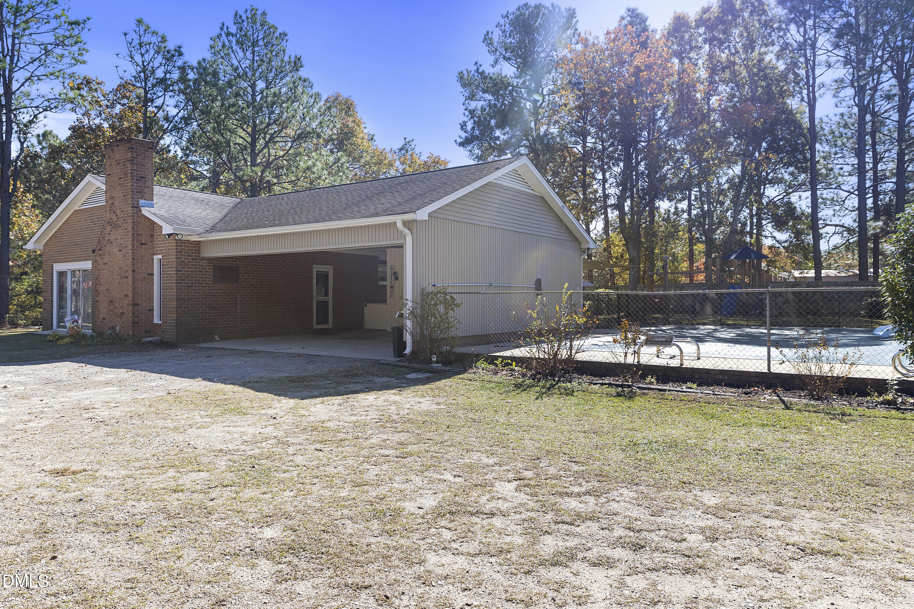2636 Nicholson Road Cameron, NC 28326 - Photo 18 of 68 a view of a house with a yard and a large tree