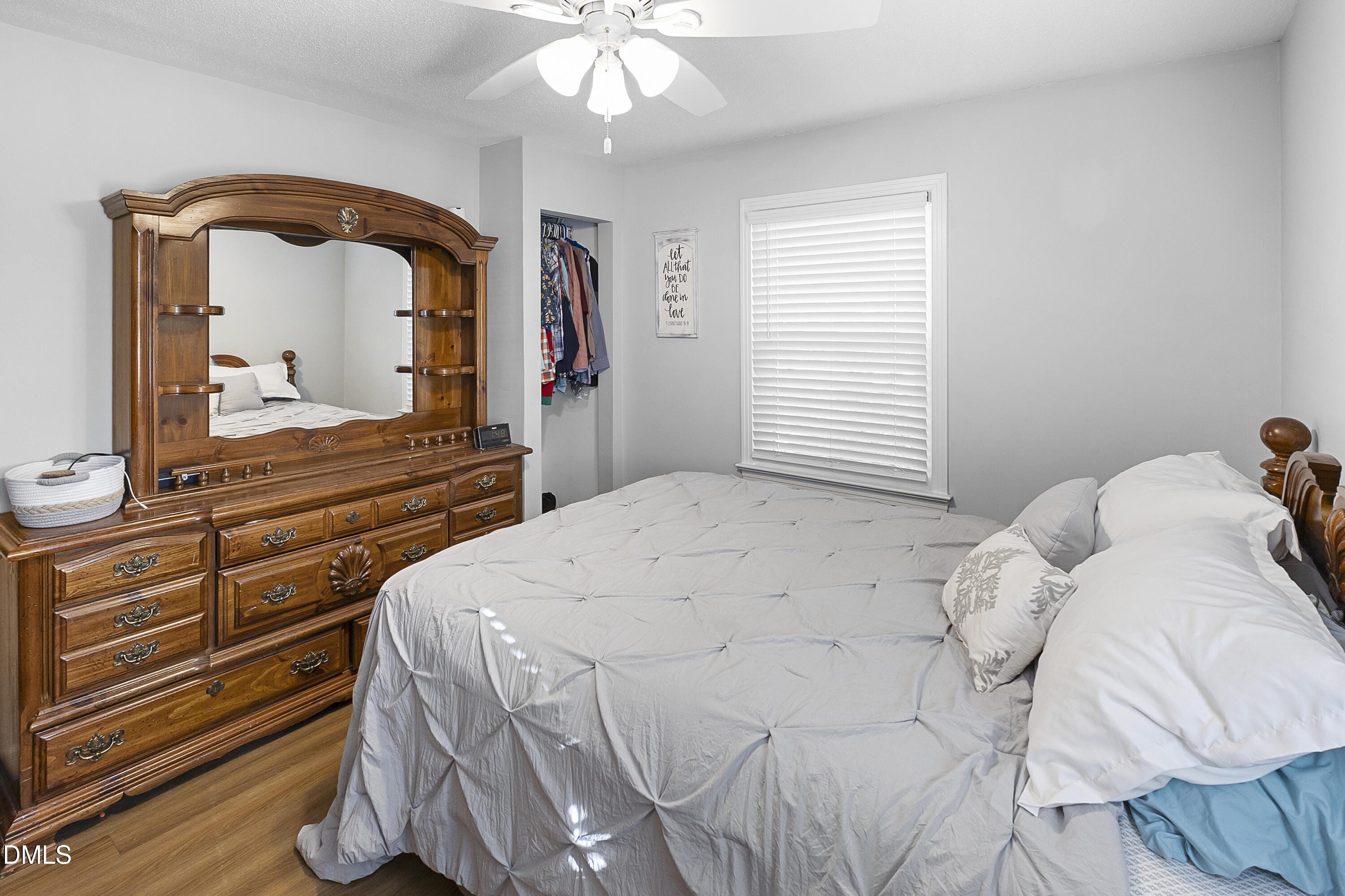 2636 Nicholson Road Cameron, NC 28326 - Photo 23 of 68 a bedroom with a bed and a mirror on dresser