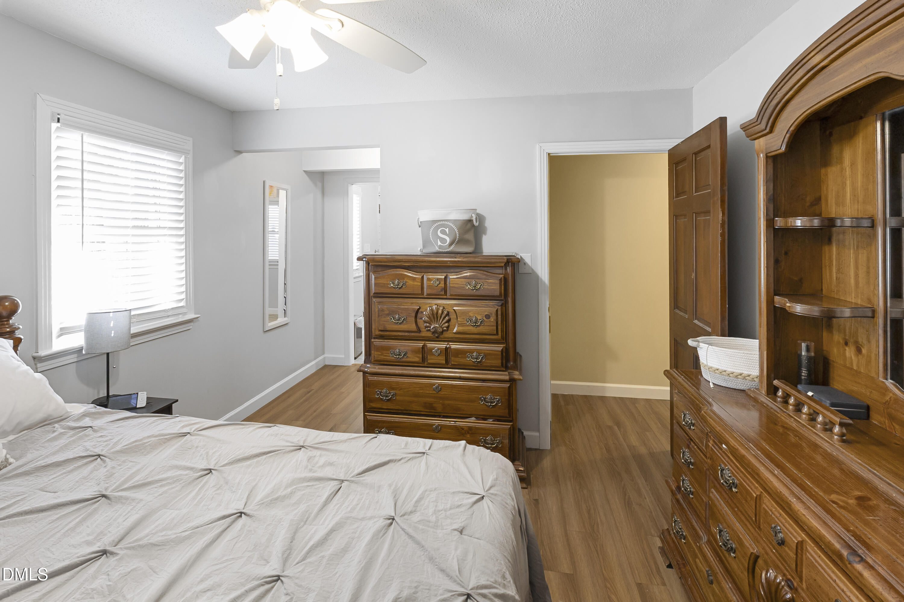 2636 Nicholson Road Cameron, NC 28326 - Photo 24 of 68 a bedroom with a bed and wooden floor