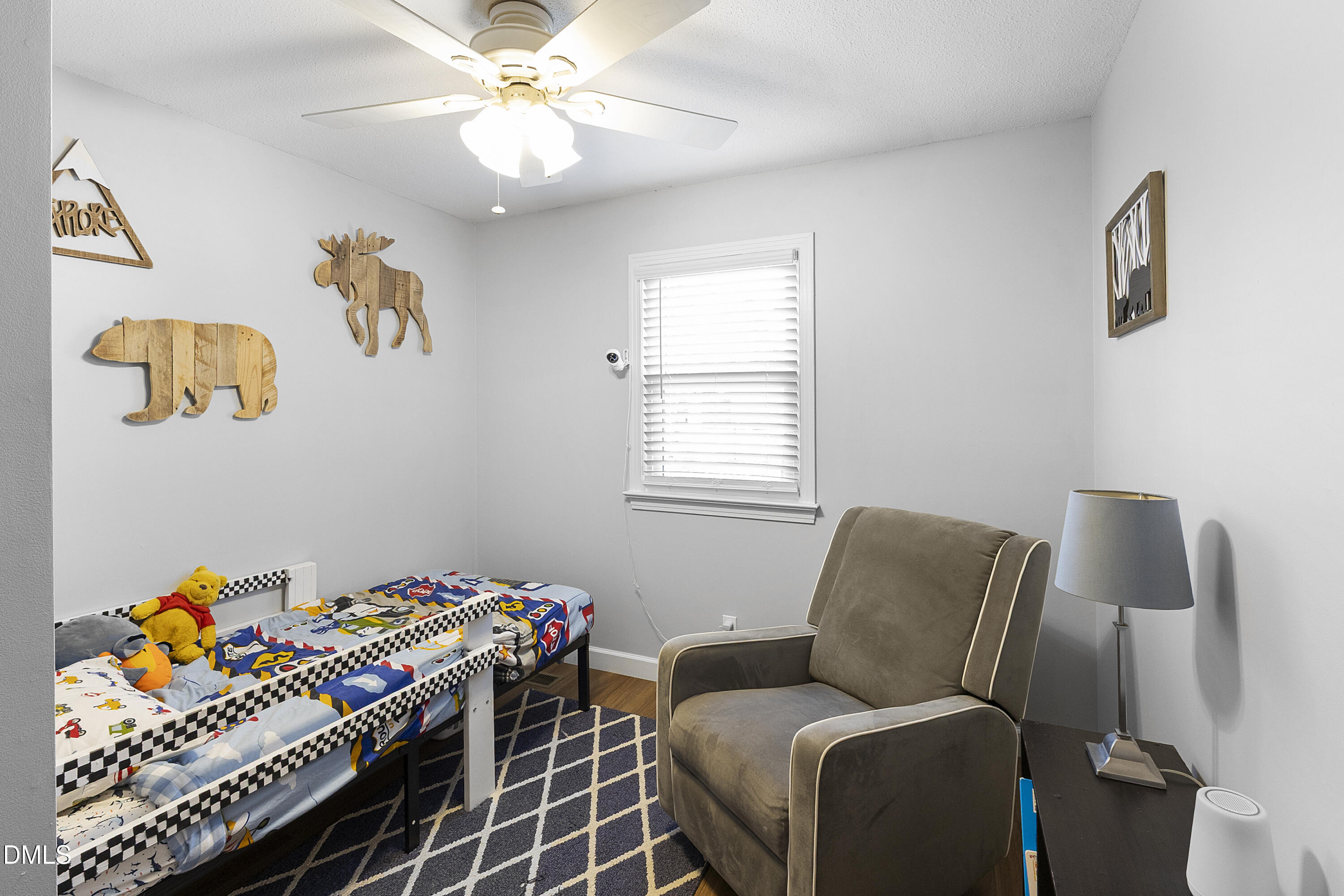 2636 Nicholson Road Cameron, NC 28326 - Photo 27 of 68 a bedroom with a bed and a chandelier