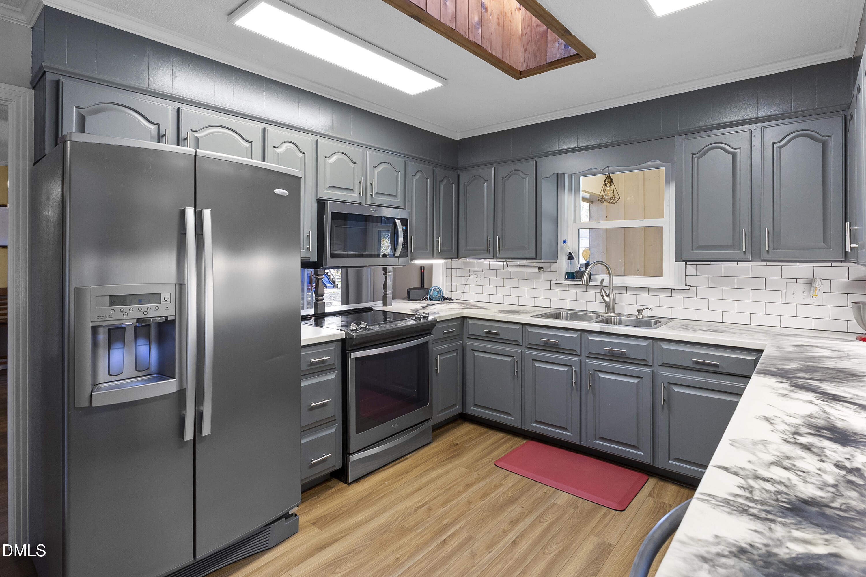 2636 Nicholson Road Cameron, NC 28326 - Photo 35 of 68 a kitchen with stainless steel appliances granite countertop a refrigerator and a sink