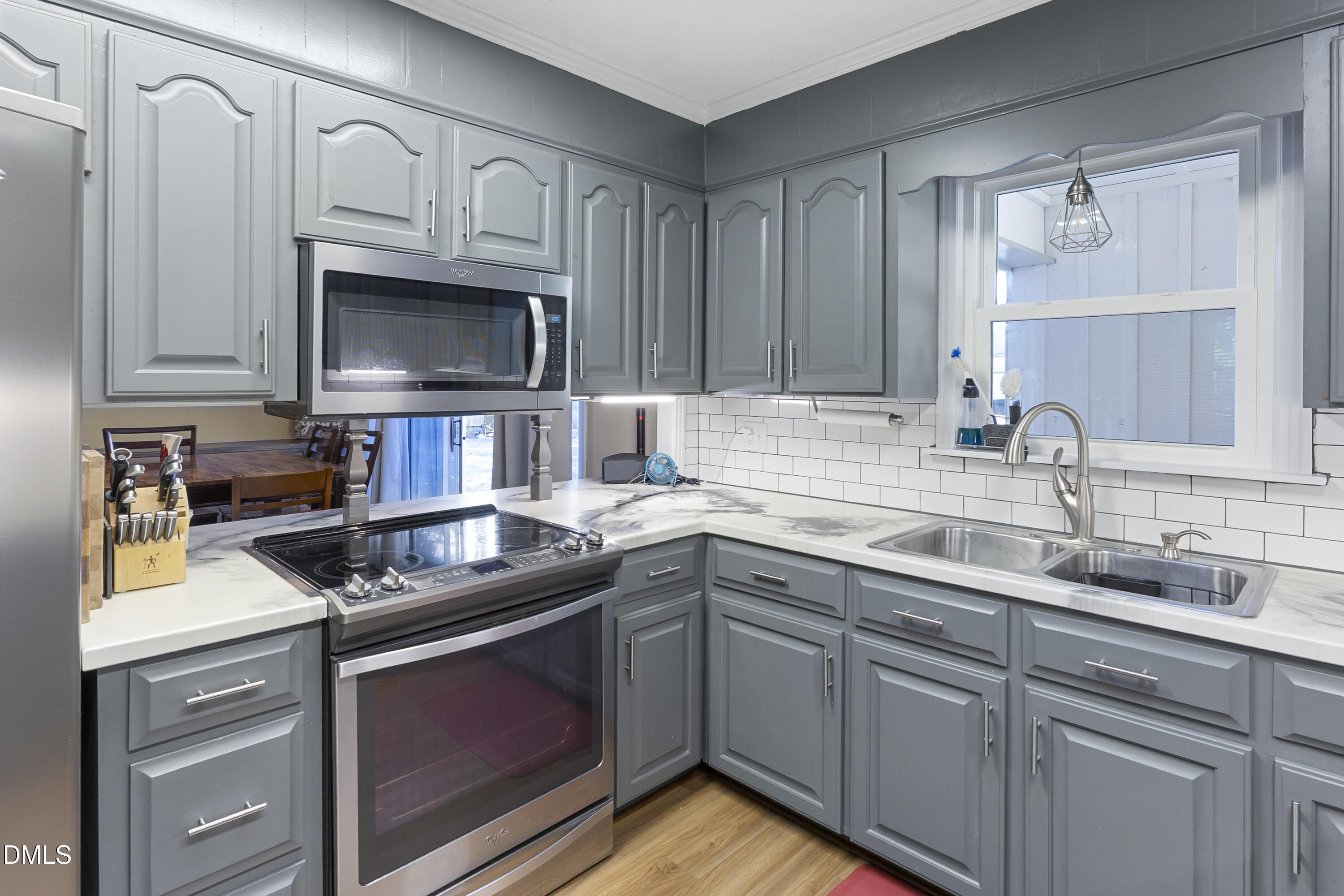 2636 Nicholson Road Cameron, NC 28326 - Photo 37 of 68 a kitchen with cabinets appliances a sink and a counter top space