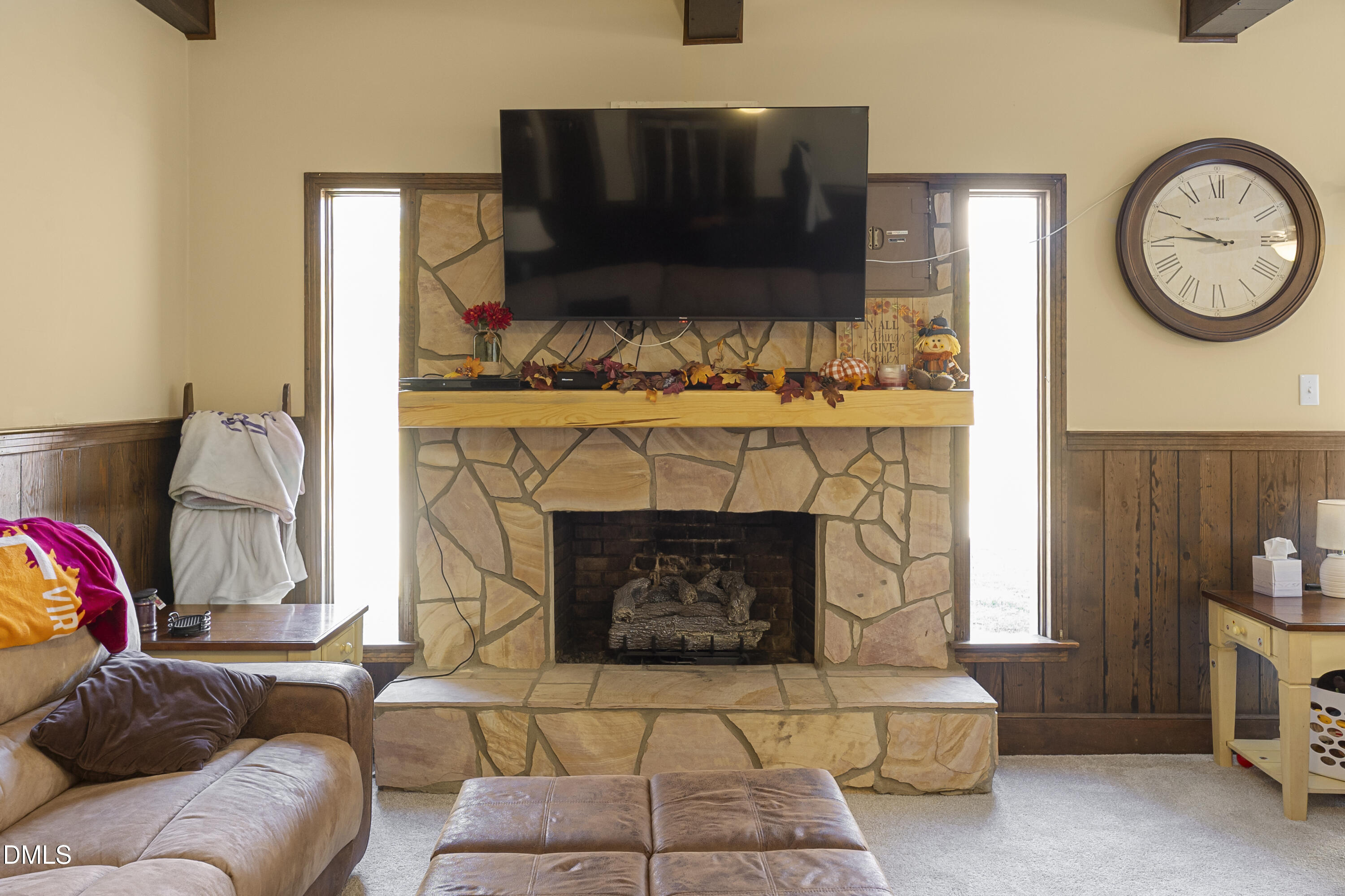 2636 Nicholson Road Cameron, NC 28326 - Photo 40 of 68 a living room with furniture a flat screen tv and a fireplace
