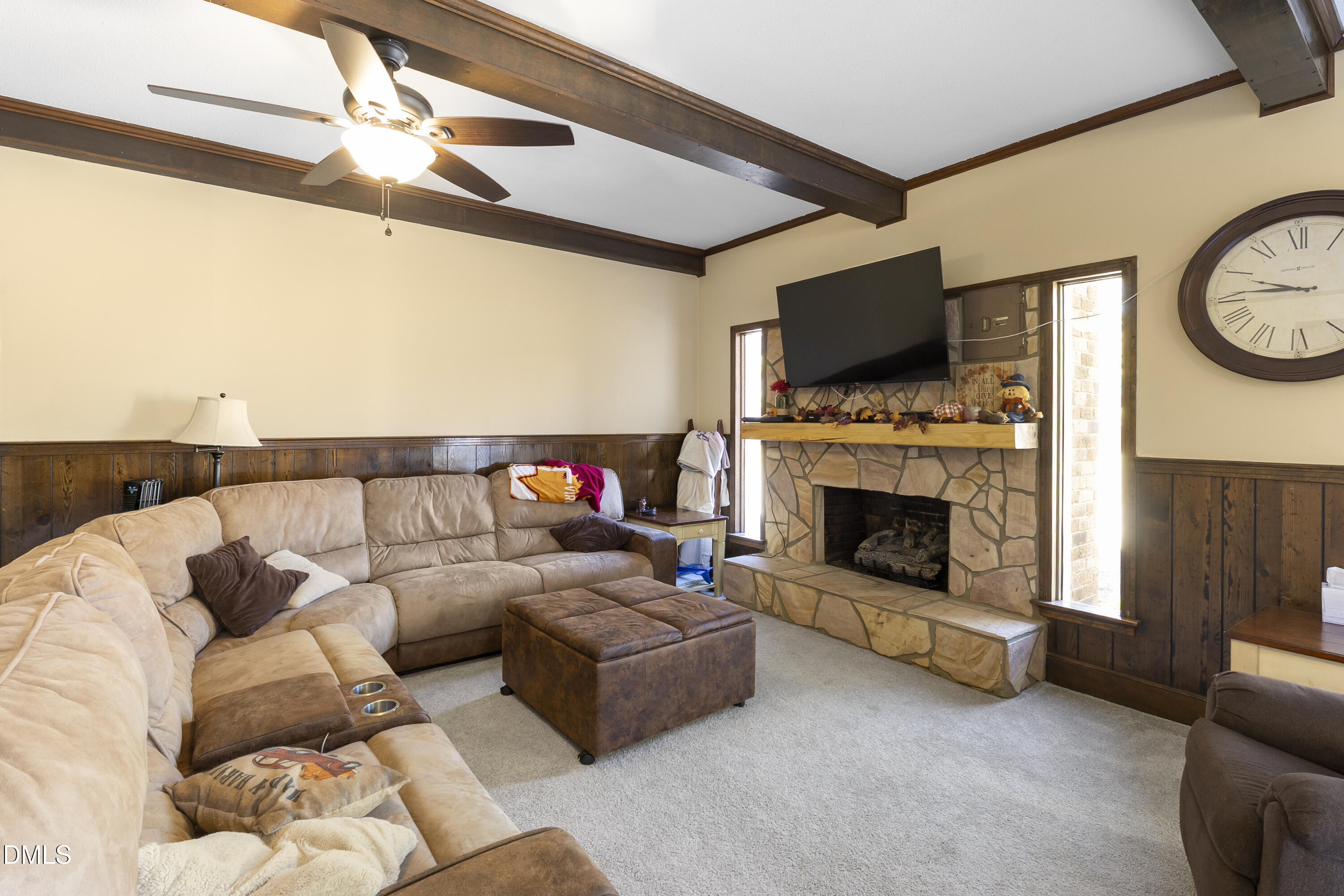 2636 Nicholson Road Cameron, NC 28326 - Photo 42 of 68 a living room with furniture a flat screen tv and a fireplace