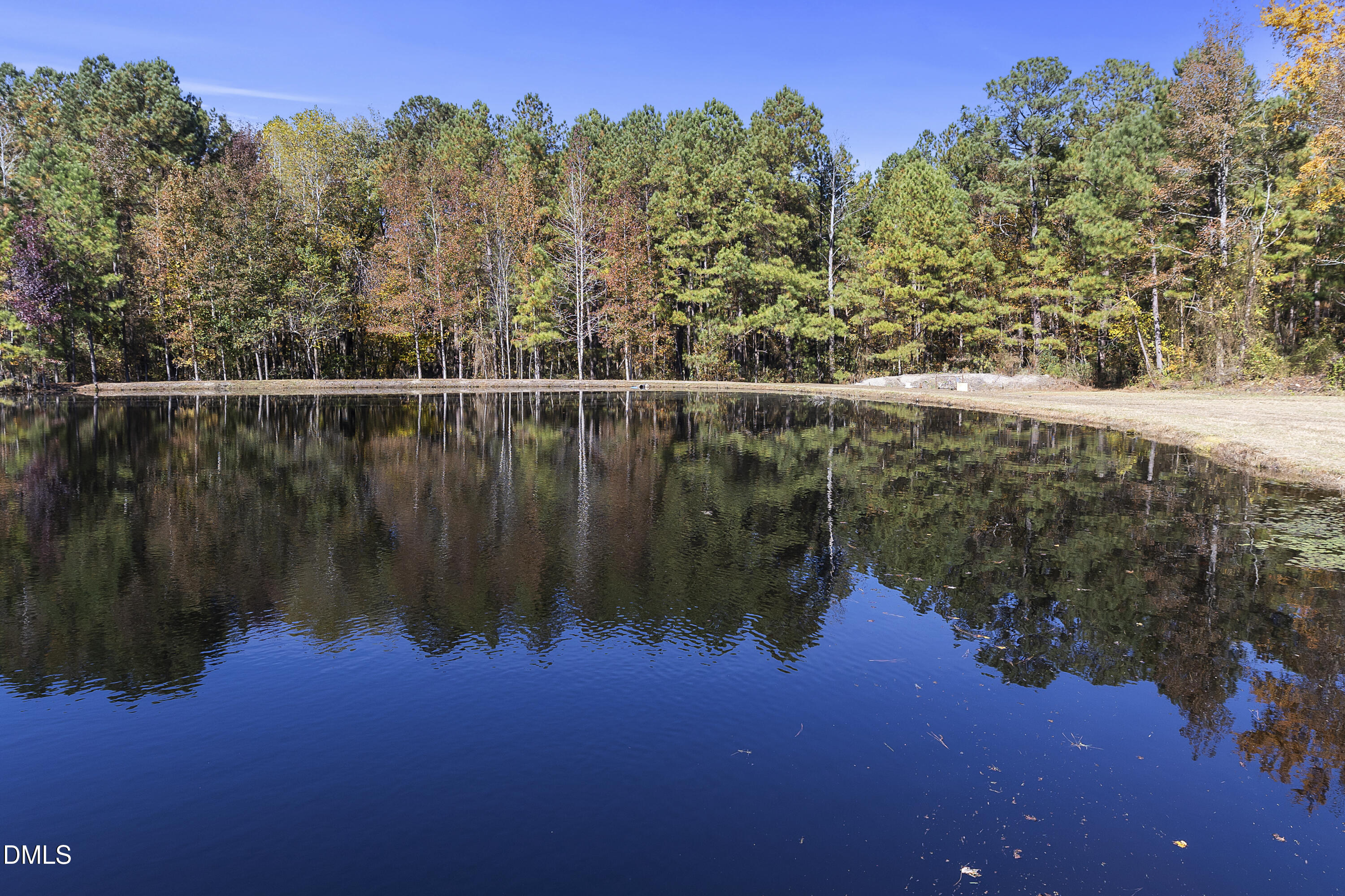 2636 Nicholson Road Cameron, NC 28326 - Photo 49 of 68 a view of a lake with a mountain in the background