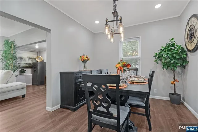 a kitchen with white cabinets and appliances