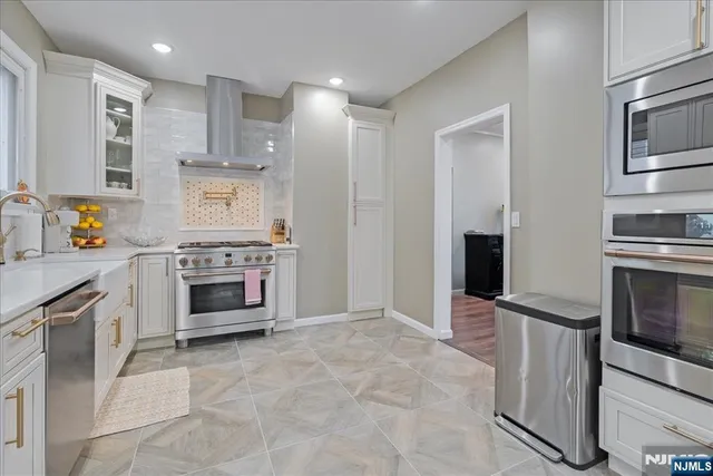 a bathroom with a sink vanity and a mirror