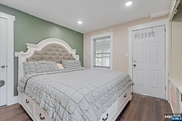 a bedroom with a bed and furniture