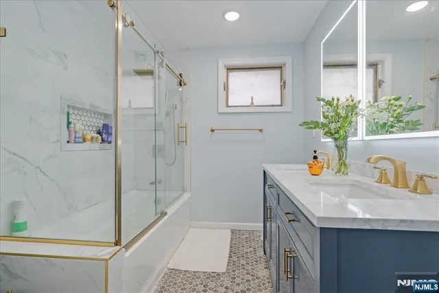 a spacious bedroom with a bed and wooden floor