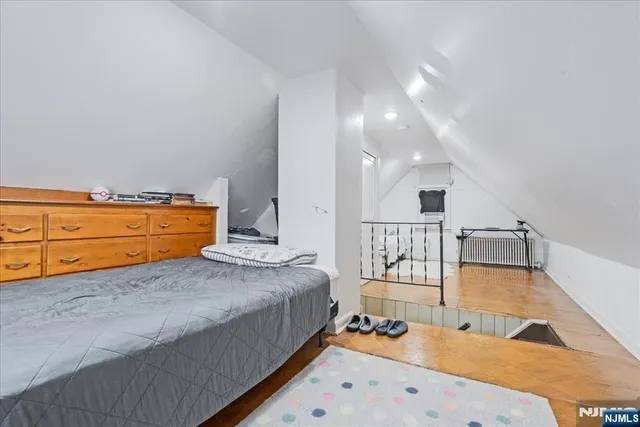 a room with a bed and a chair in it