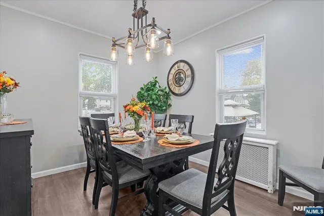 a view of a dining room with furniture and wooden floor