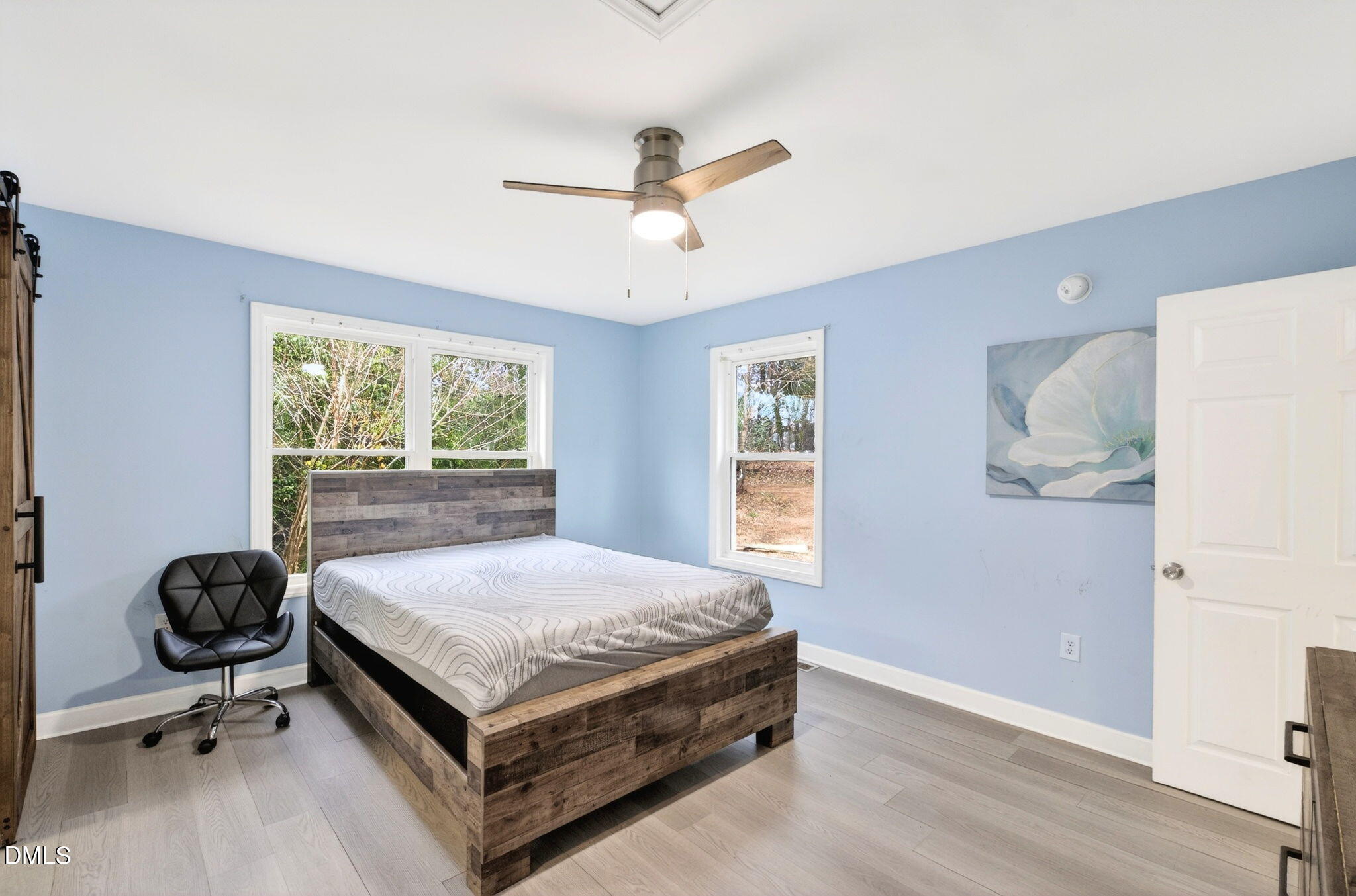 1809 Martin Luther King Jr Boulevard Raleigh, NC 27610 - Photo 13 of 26 a bedroom with a bed and window