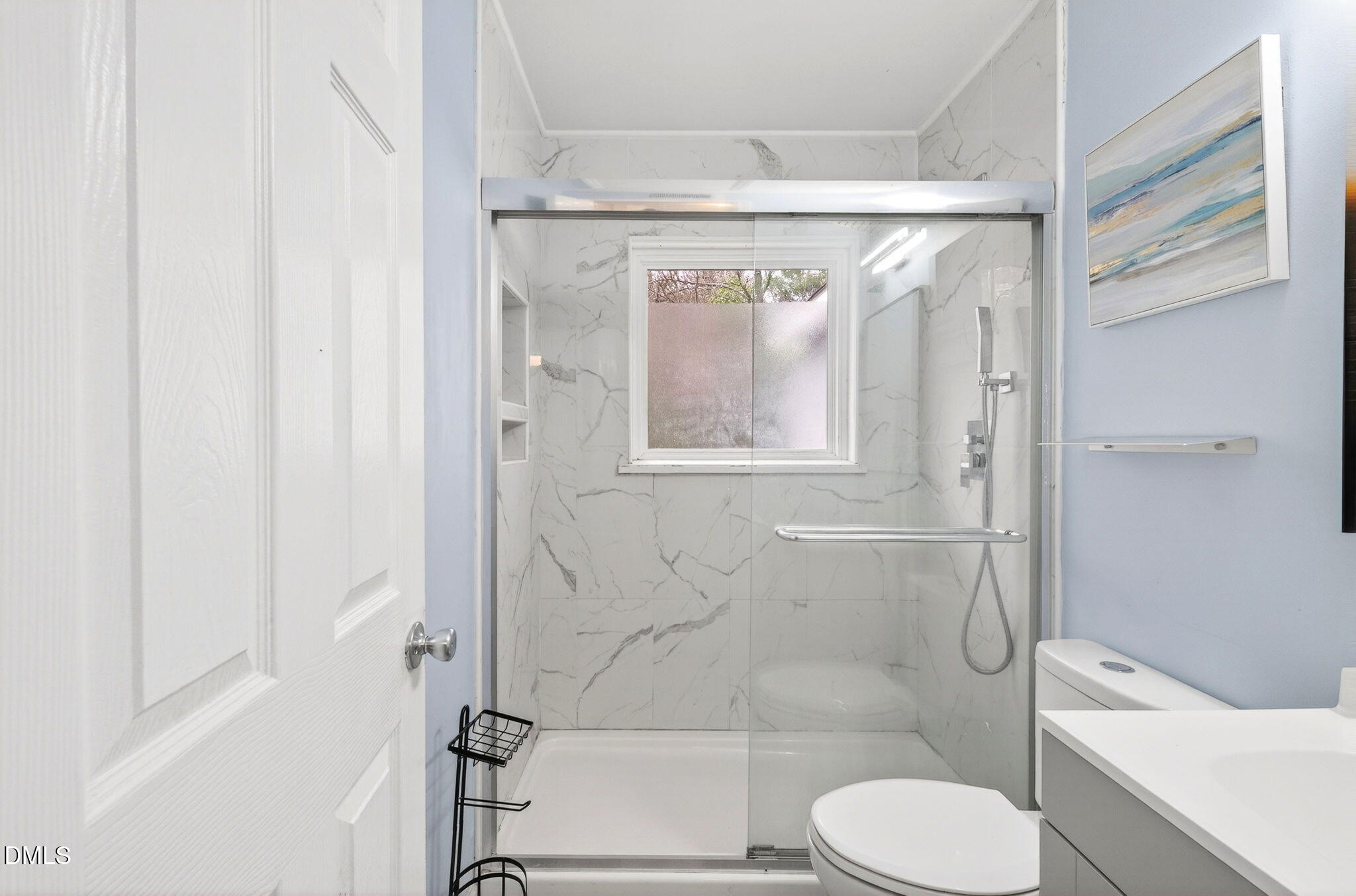 1809 Martin Luther King Jr Boulevard Raleigh, NC 27610 - Photo 14 of 26 a bathroom with a shower and toilet