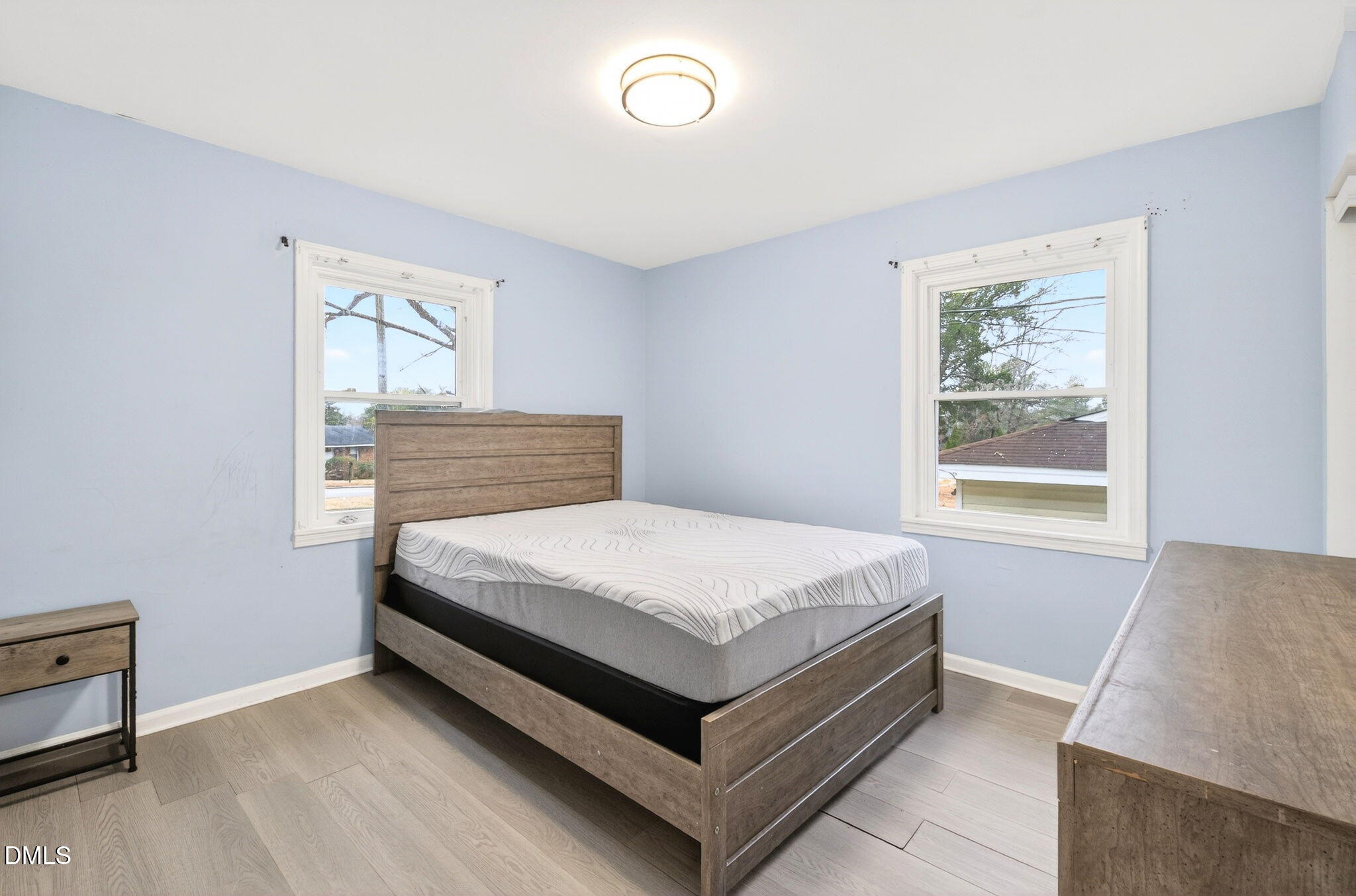 1809 Martin Luther King Jr Boulevard Raleigh, NC 27610 - Photo 20 of 26 a bedroom with a bed and window