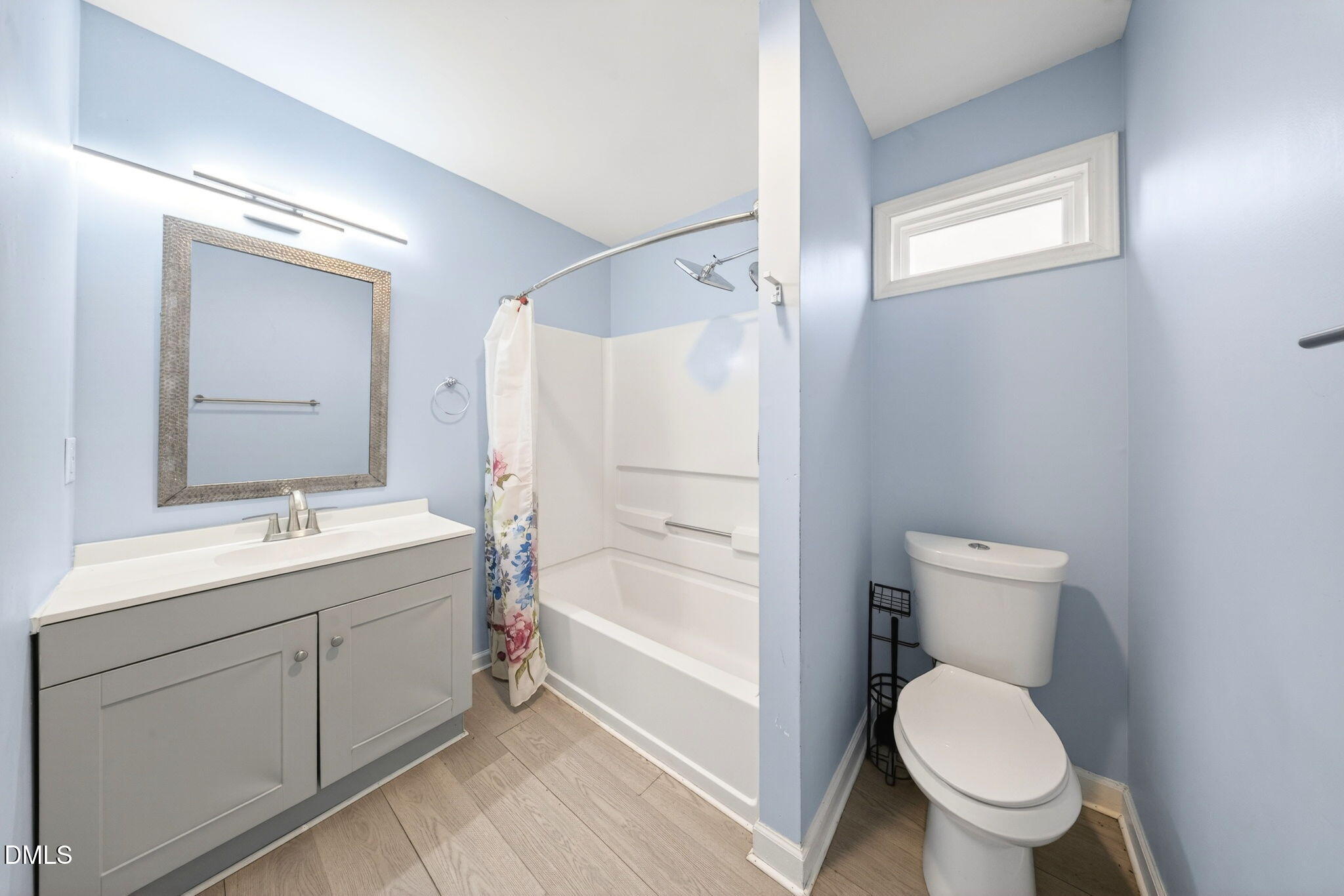 1809 Martin Luther King Jr Boulevard Raleigh, NC 27610 - Photo 23 of 26 a bathroom with a toilet sink and mirror