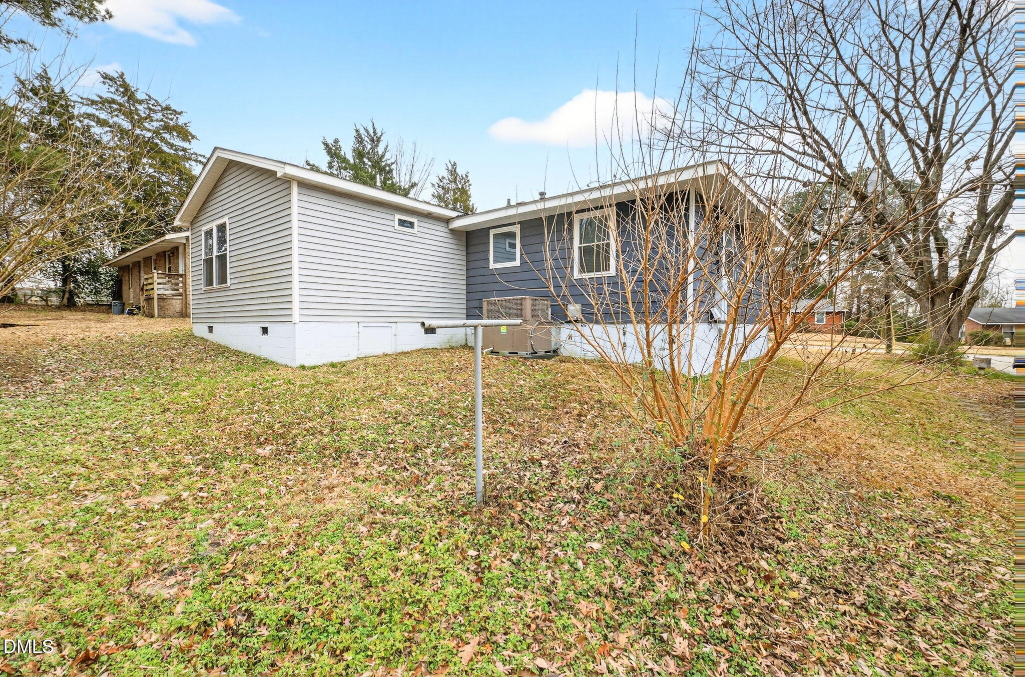 1809 Martin Luther King Jr Boulevard Raleigh, NC 27610 - Photo 24 of 26 a backyard of a house with table and chairs