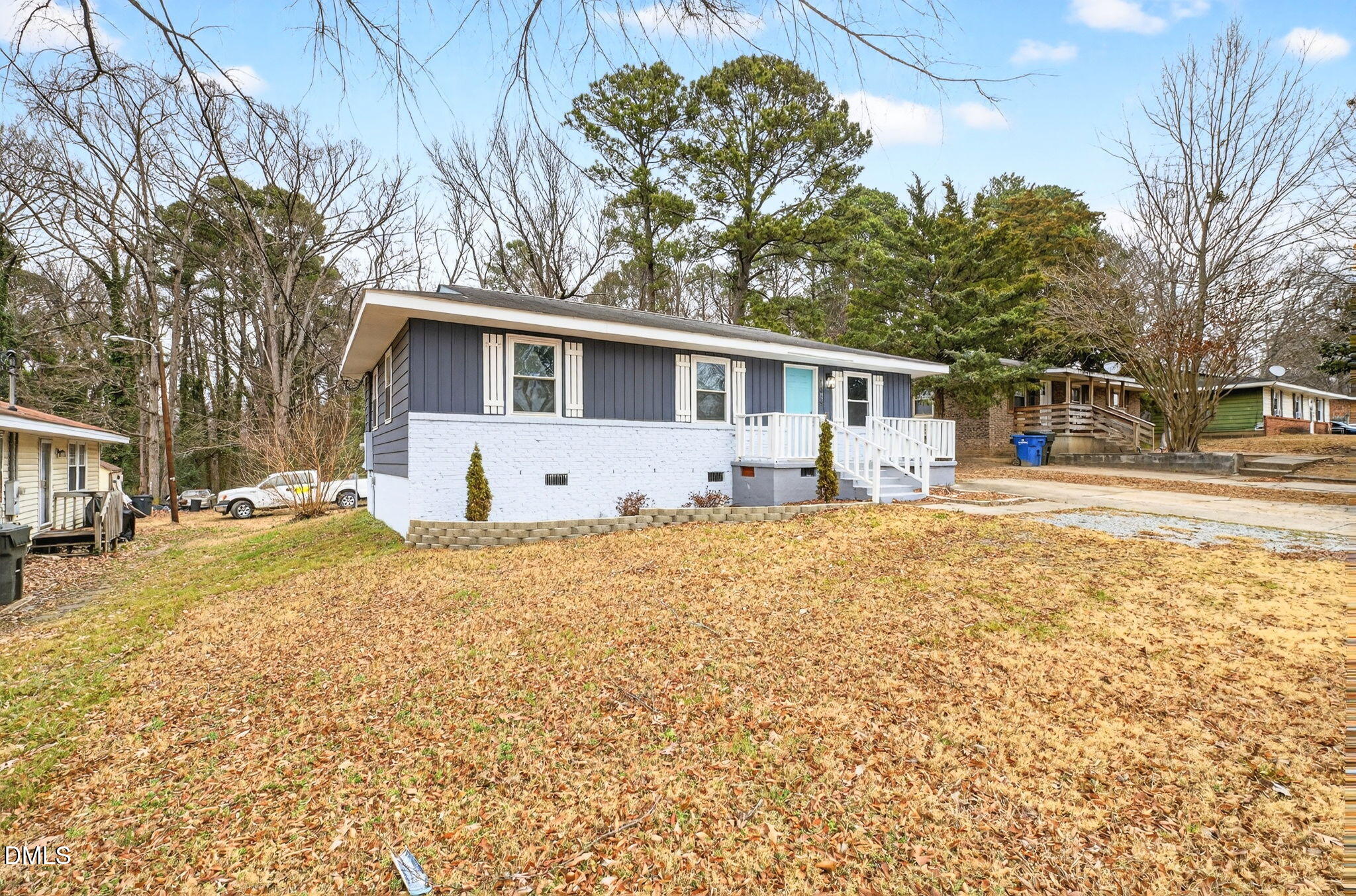 1809 Martin Luther King Jr Boulevard Raleigh, NC 27610 - Photo 2 of 26 a front view of house with yard and trees around