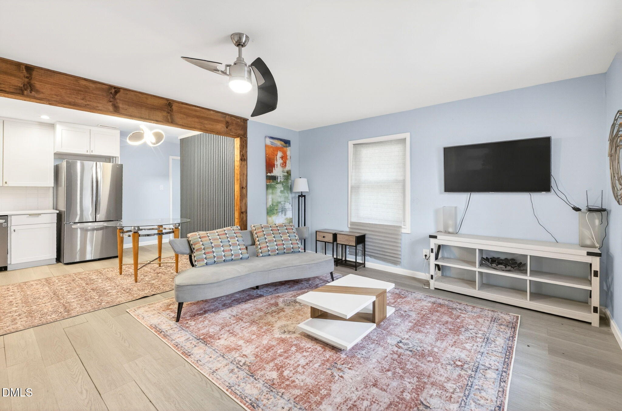 1809 Martin Luther King Jr Boulevard Raleigh, NC 27610 - Photo 3 of 26 a living room with furniture and a flat screen tv