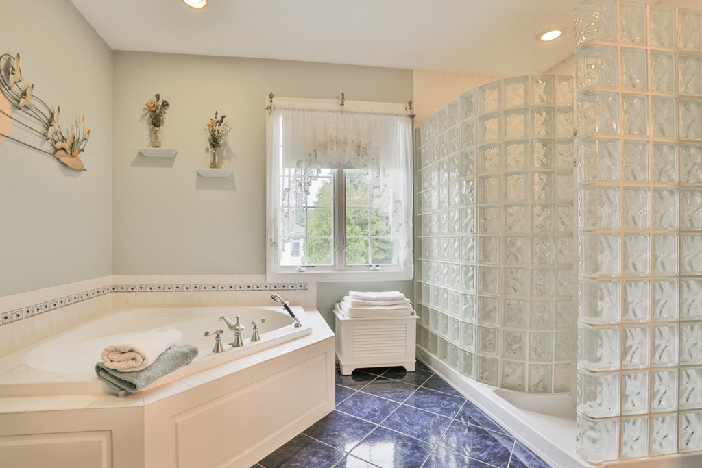 34 Sawmill Ridge Road Haverhill, MA 01832 - Photo 12 of 30 a bathroom with a bathtub and a shower
