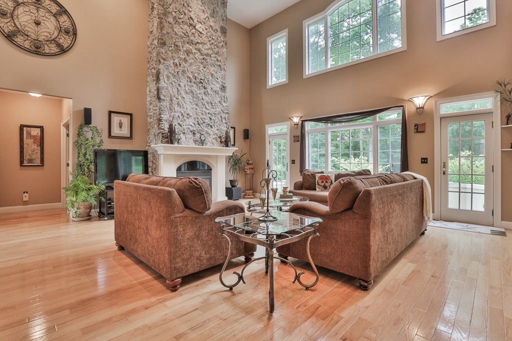 34 Sawmill Ridge Road Haverhill, MA 01832 - Photo 4 of 30 a living room with furniture a fireplace and a large window